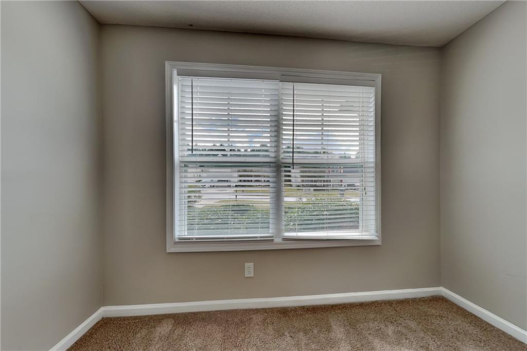 3762 Plymouth Rock Drive Loganville, GA 30052 - Photo 19 of 28 a view of a window in an empty room