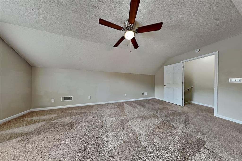 3762 Plymouth Rock Drive Loganville, GA 30052 - Photo 22 of 28 a view of a big room with a ceiling fan