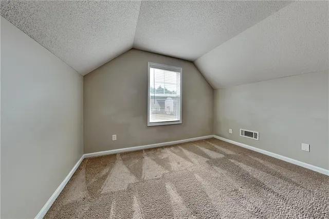 a house with a small yard and garden space