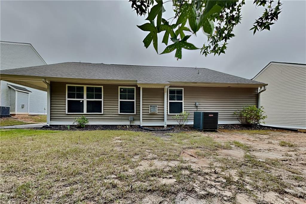 3762 Plymouth Rock Drive Loganville, GA 30052 - Photo 26 of 28 a view of a house with a yard