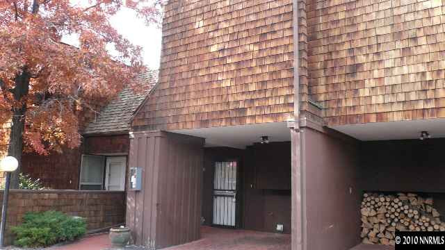 4235 Baker Lane Reno, NV 89509 - Photo 1 of 10 a view of a brick house with a large tree