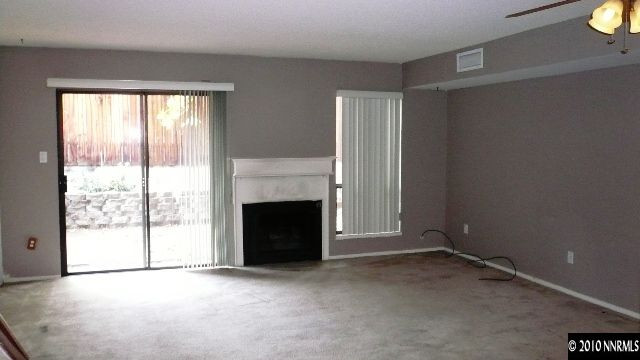 4235 Baker Lane Reno, NV 89509 - Photo 3 of 10 a view of empty room with a fireplace