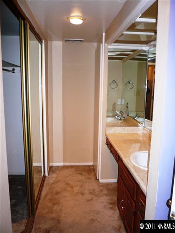 4235 Baker Lane Reno, NV 89509 - Photo 5 of 10 a bathroom with a granite countertop sink and a mirror