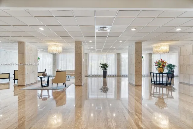 a view of a dining hall with a dining table chairs and couches
