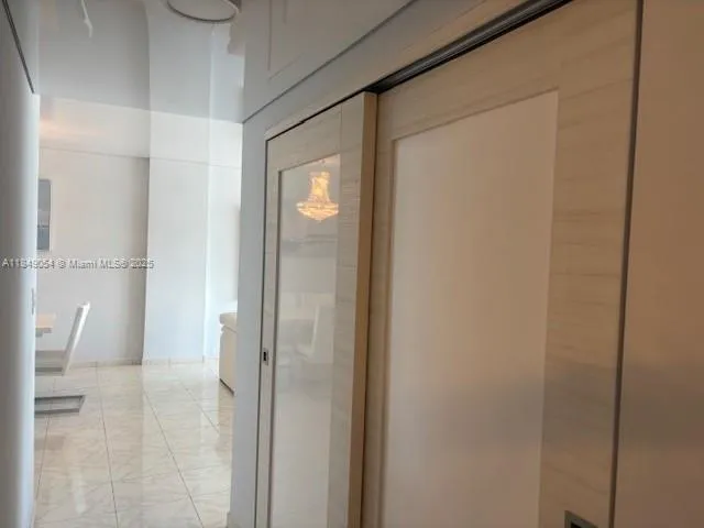 a view of a bathroom from a hallway