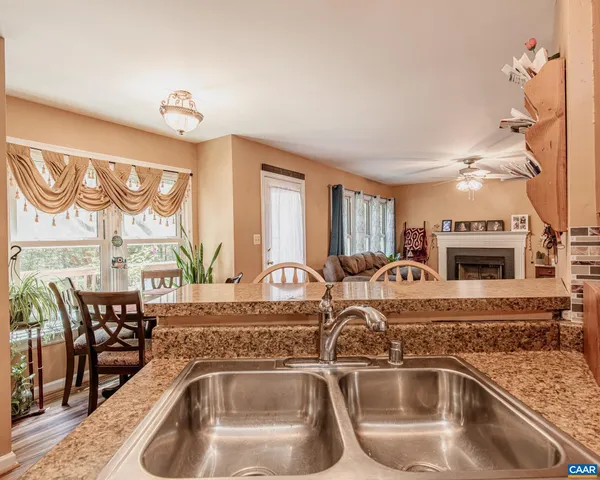 a close view of a sink a faucet a fireplace and furniture