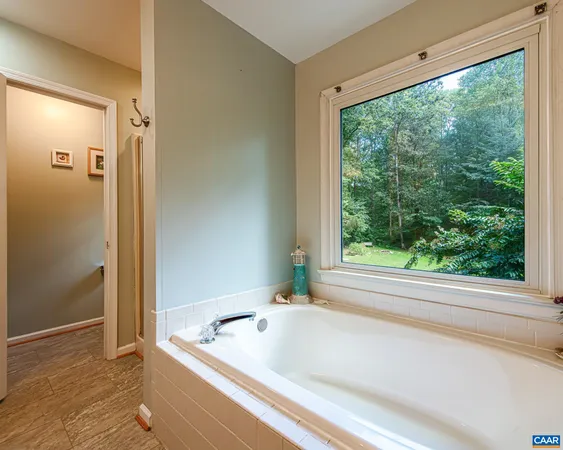 a bathroom with a tub and shower