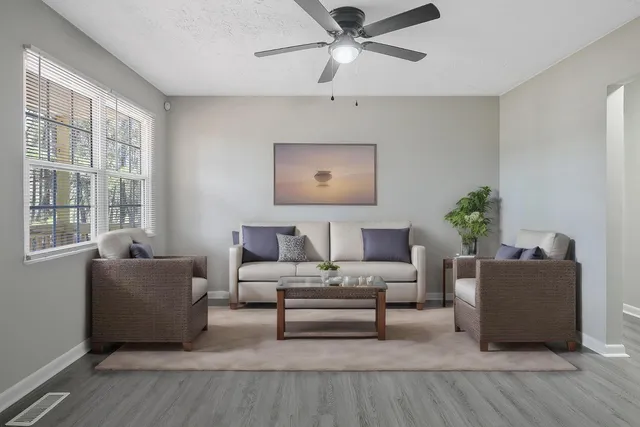 a living room with furniture and a window