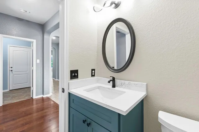 a bathroom with a sink and a mirror