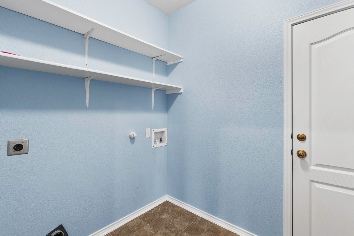 345 Apricot Drive Kyle, TX 78640 - Photo 26 of 37 a view of small space with racks on the wall