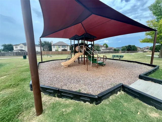 an outdoor space with furniture and umbrella