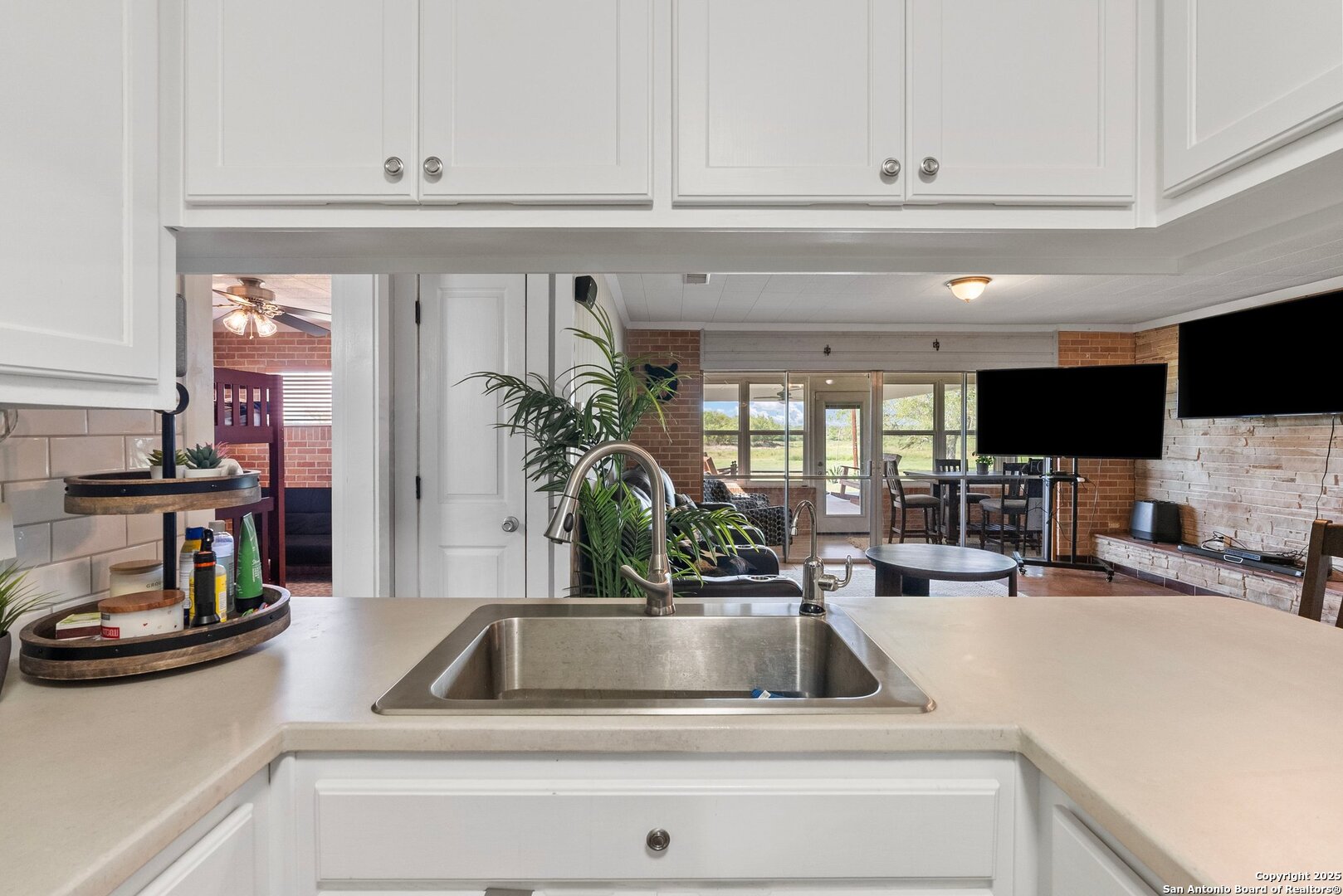 180 Freeman Circle George West, TX 78022 - Photo 12 of 41 a kitchen with sink and cabinets