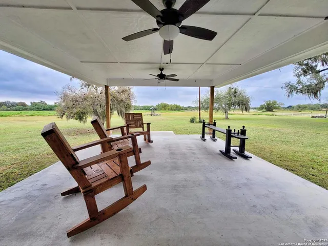 a view of a house with a swimming pool and a yard