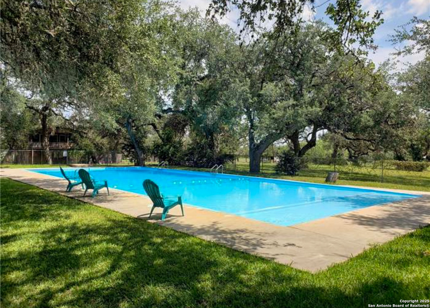 180 Freeman Circle George West, TX 78022 - Photo 40 of 41 a view of a swimming pool with a yard