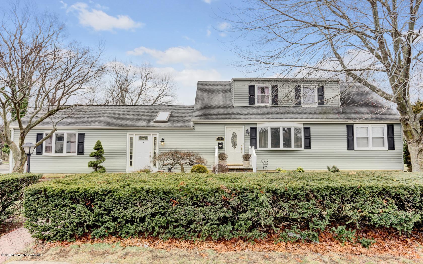 40 Drift Road Middletown, NJ 07718 - Photo 1 of 25 a front view of a house with a garden