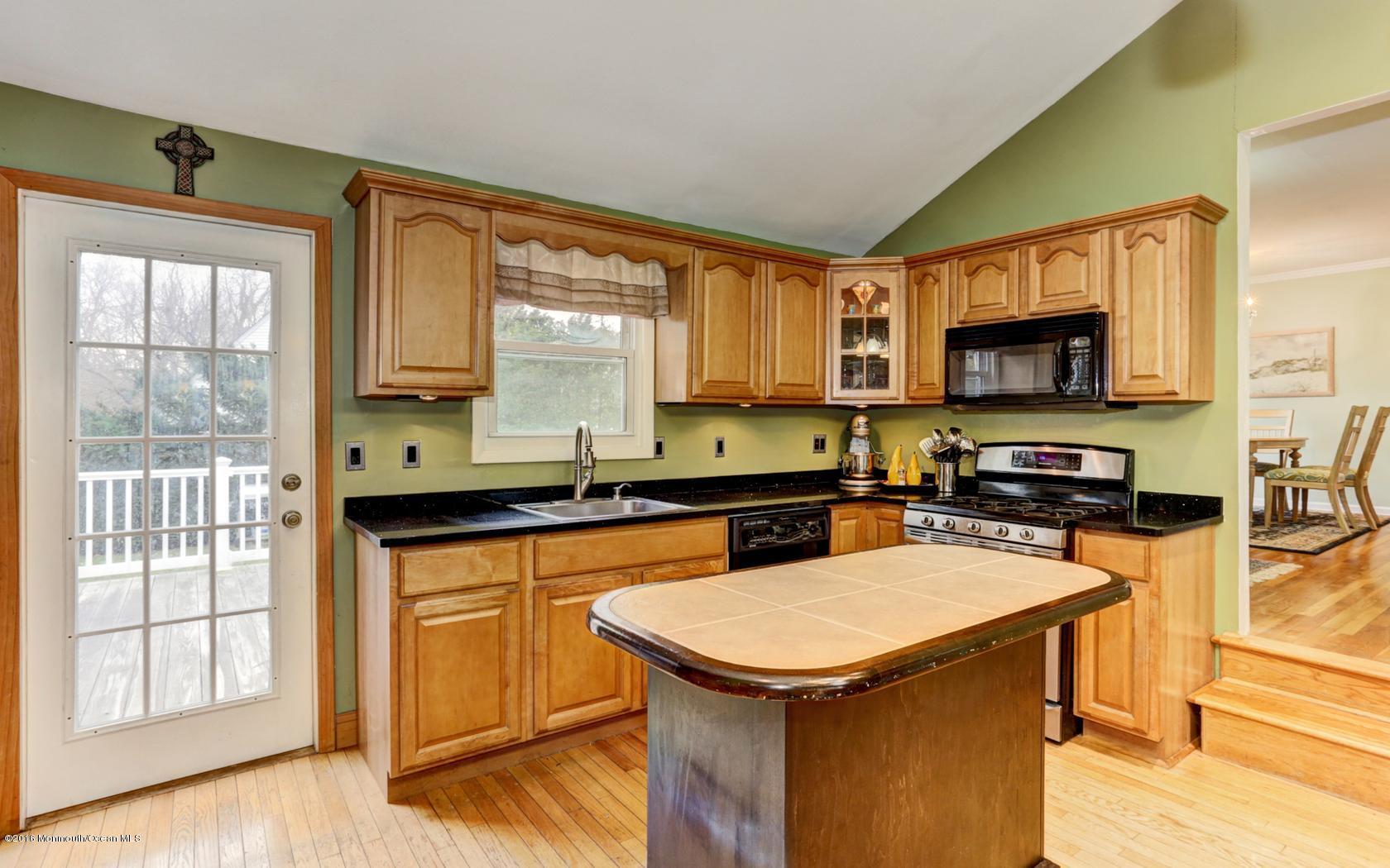 40 Drift Road Middletown, NJ 07718 - Photo 14 of 25 a kitchen with a stove a sink and a microwave