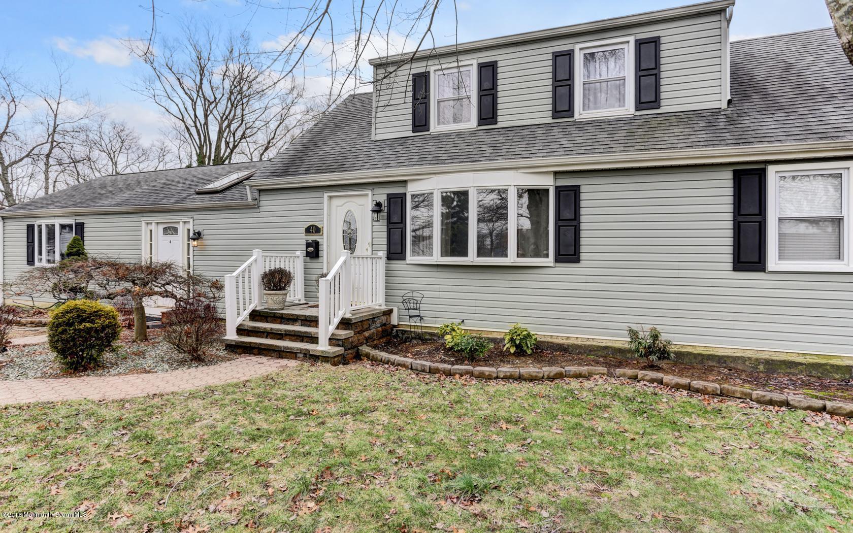 40 Drift Road Middletown, NJ 07718 - Photo 3 of 25 a couple of table and chairs in front of house