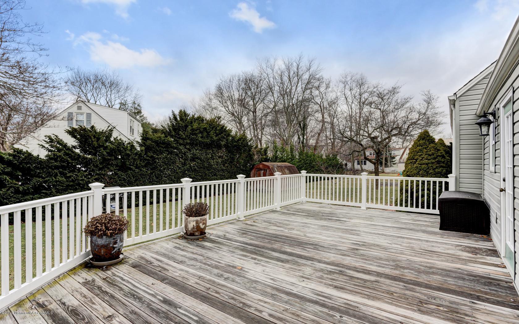 40 Drift Road Middletown, NJ 07718 - Photo 22 of 25 a balcony with view of trees in the background