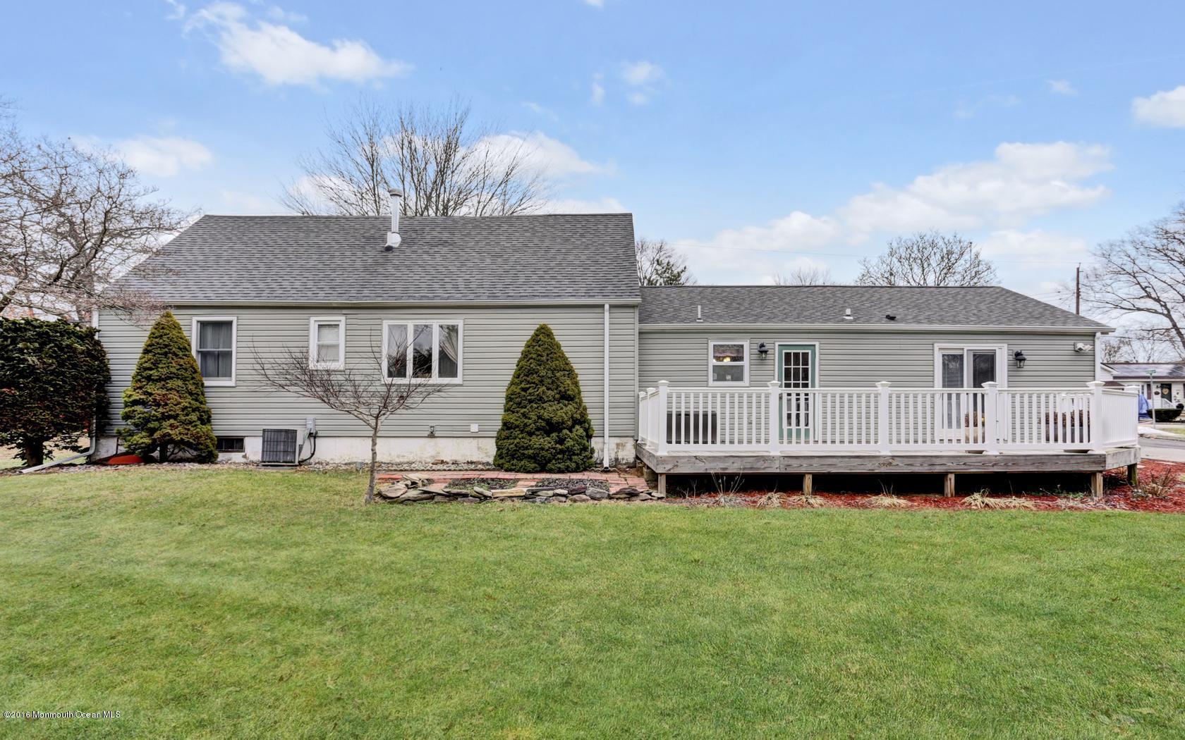 40 Drift Road Middletown, NJ 07718 - Photo 23 of 25 a view of a house with a backyard and a garden
