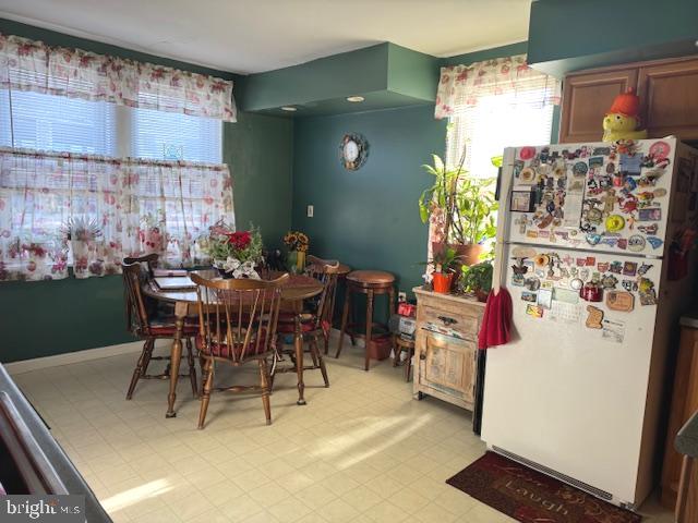 548 Hellerman Street Philadelphia, PA 19111 - Photo 14 of 30 a view of a dining room with furniture and a chandelier