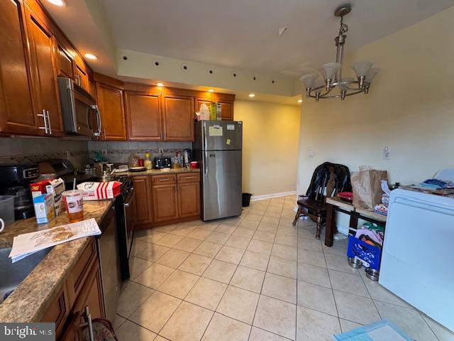 548 Hellerman Street Philadelphia, PA 19111 - Photo 9 of 30 a kitchen with refrigerator and cabinets