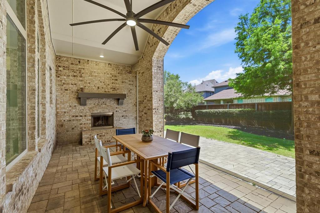 1933 Snapdragon Road Frisco, TX 75033 - Photo 36 of 40 Covered patio featuring brick masonry walls and arched entry