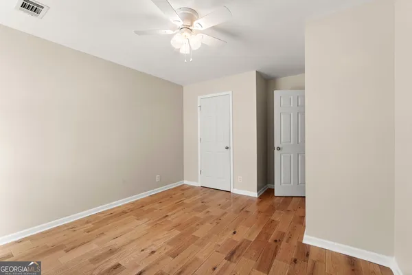 a view of a hallway with a chandelier
