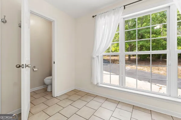 a view of porch with wooden floor