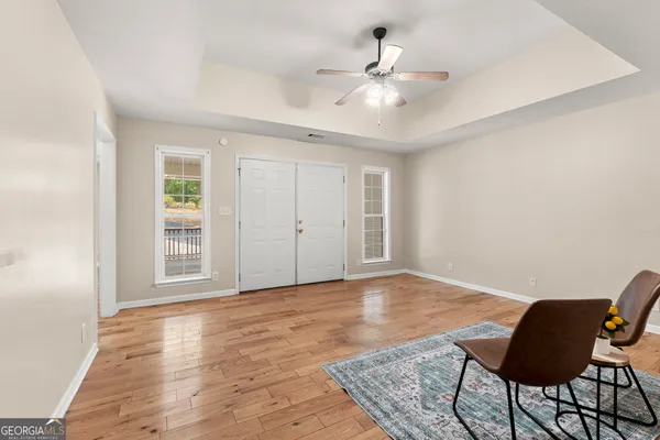 a spacious bathroom with a double vanity sink mirror and toilet