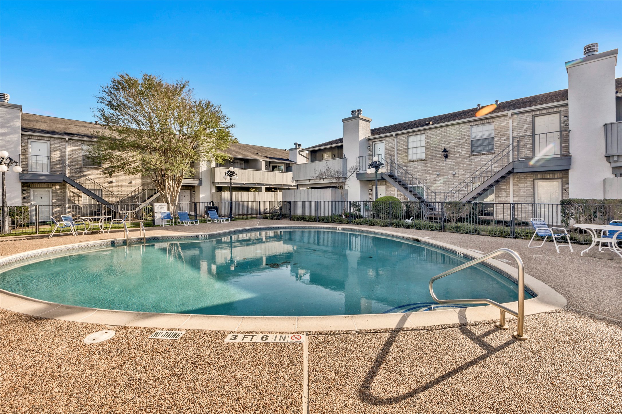 8787 Brae Acres Road, Unit 307 Houston, TX 77074 - Photo 13 of 15 a view of a swimming pool with a patio