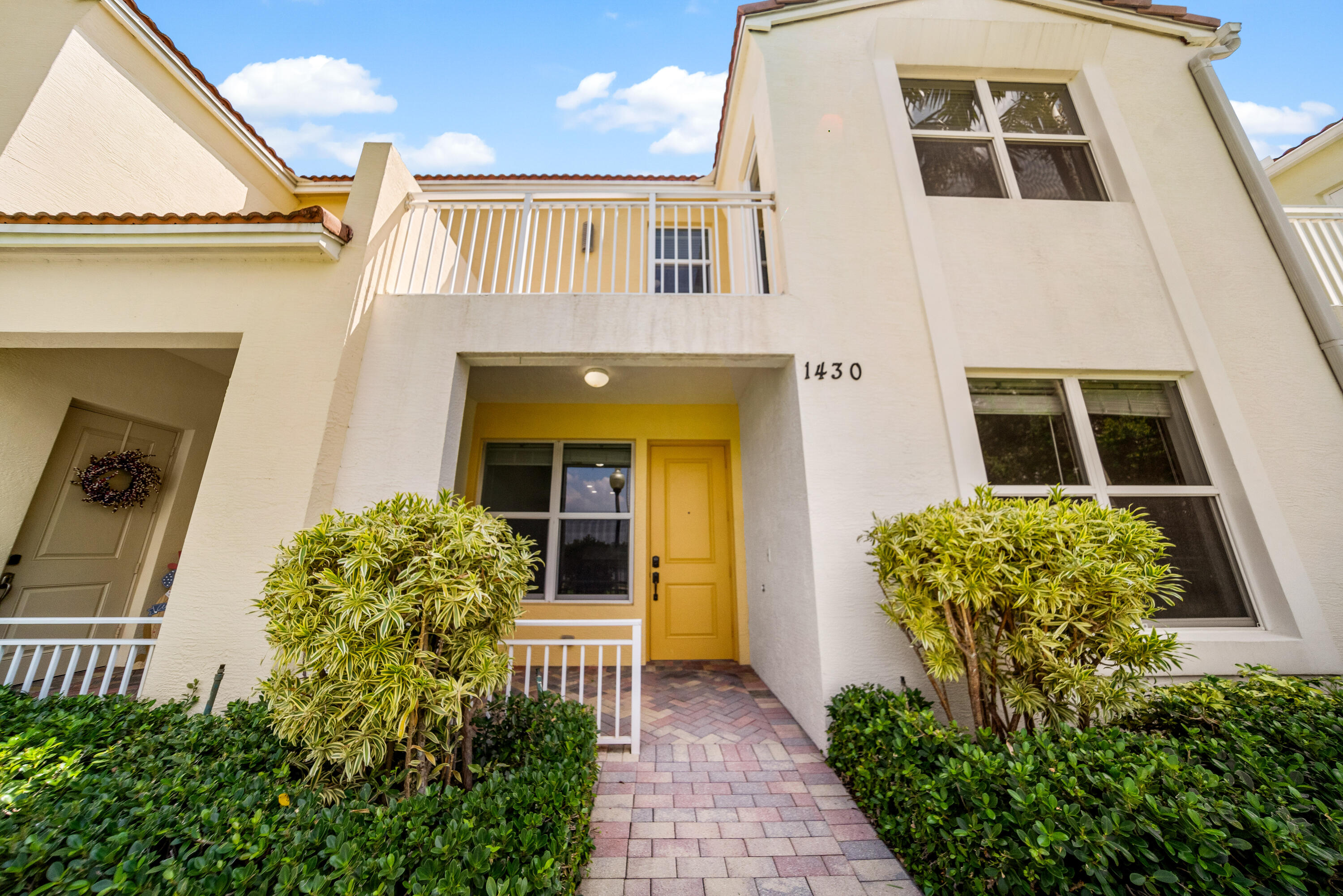 1430 Northwest 48th Lane Boca Raton, FL 33431 - Photo 39 of 54 a front view of a house with a yard