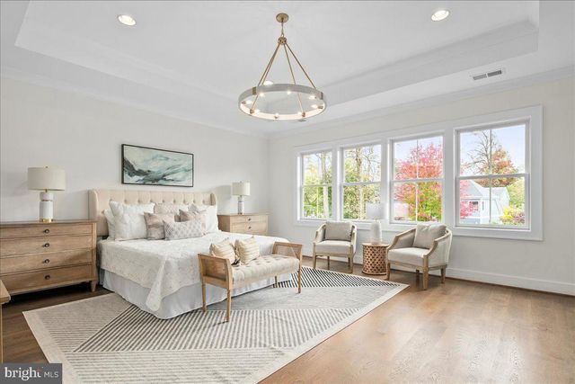 a bedroom with a large bed and a couch