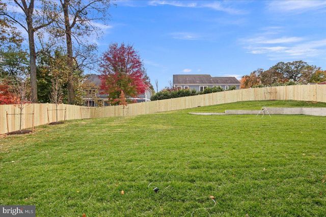 a view of a field with an ocean view