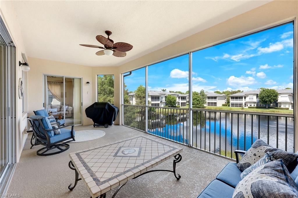 3530 Lansing Loop, Unit 202 Estero, FL 33928 - Photo 5 of 35 a living room with furniture a ceiling fan and a rug