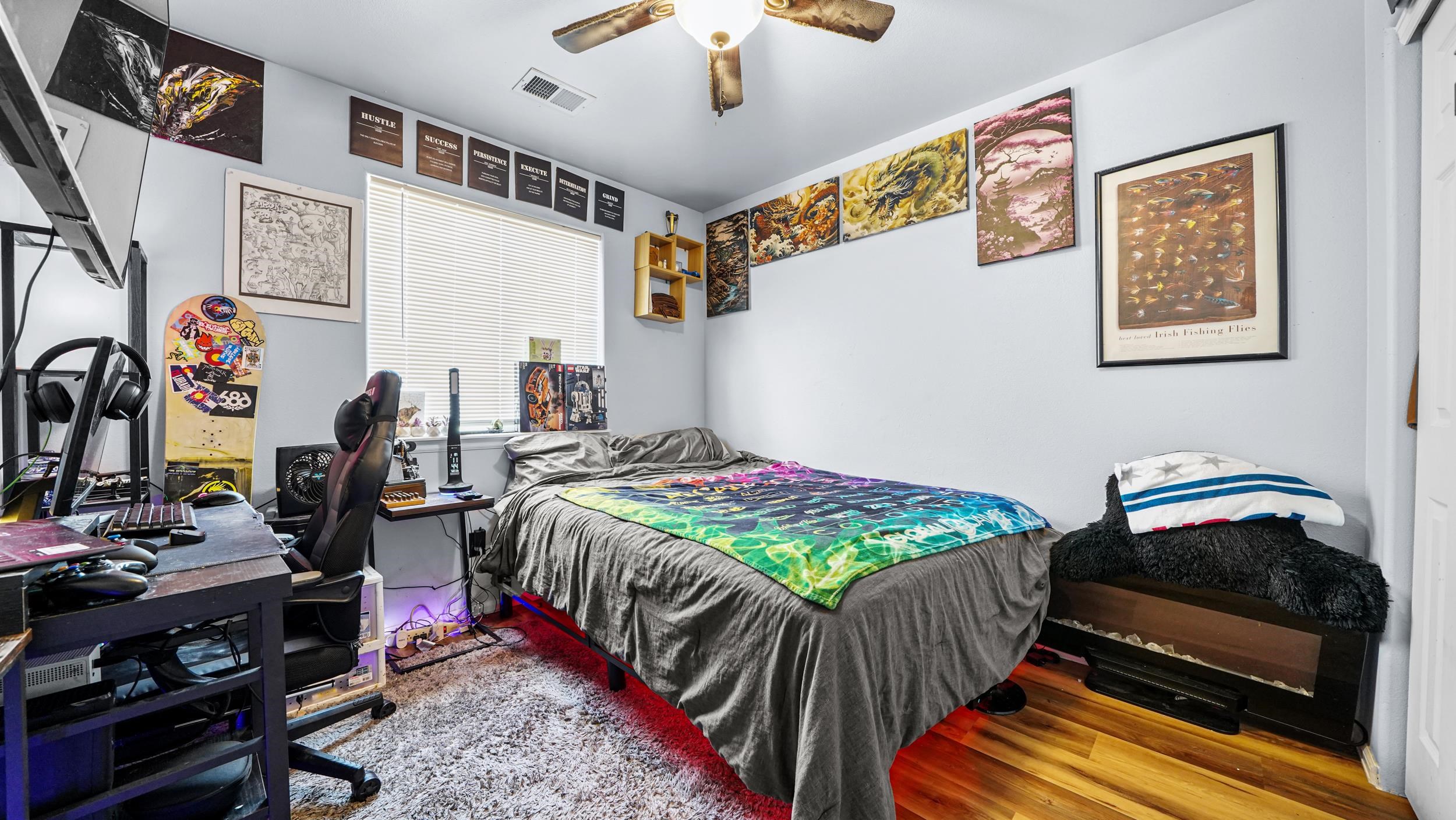 1755 Christopher Way Grand Junction, CO 81503 - Photo 20 of 30 a bedroom with bed and a chandelier
