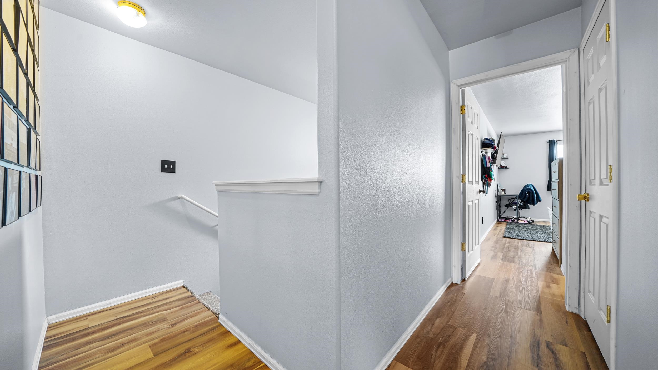 1755 Christopher Way Grand Junction, CO 81503 - Photo 21 of 30 a view of a hallway with wooden floor