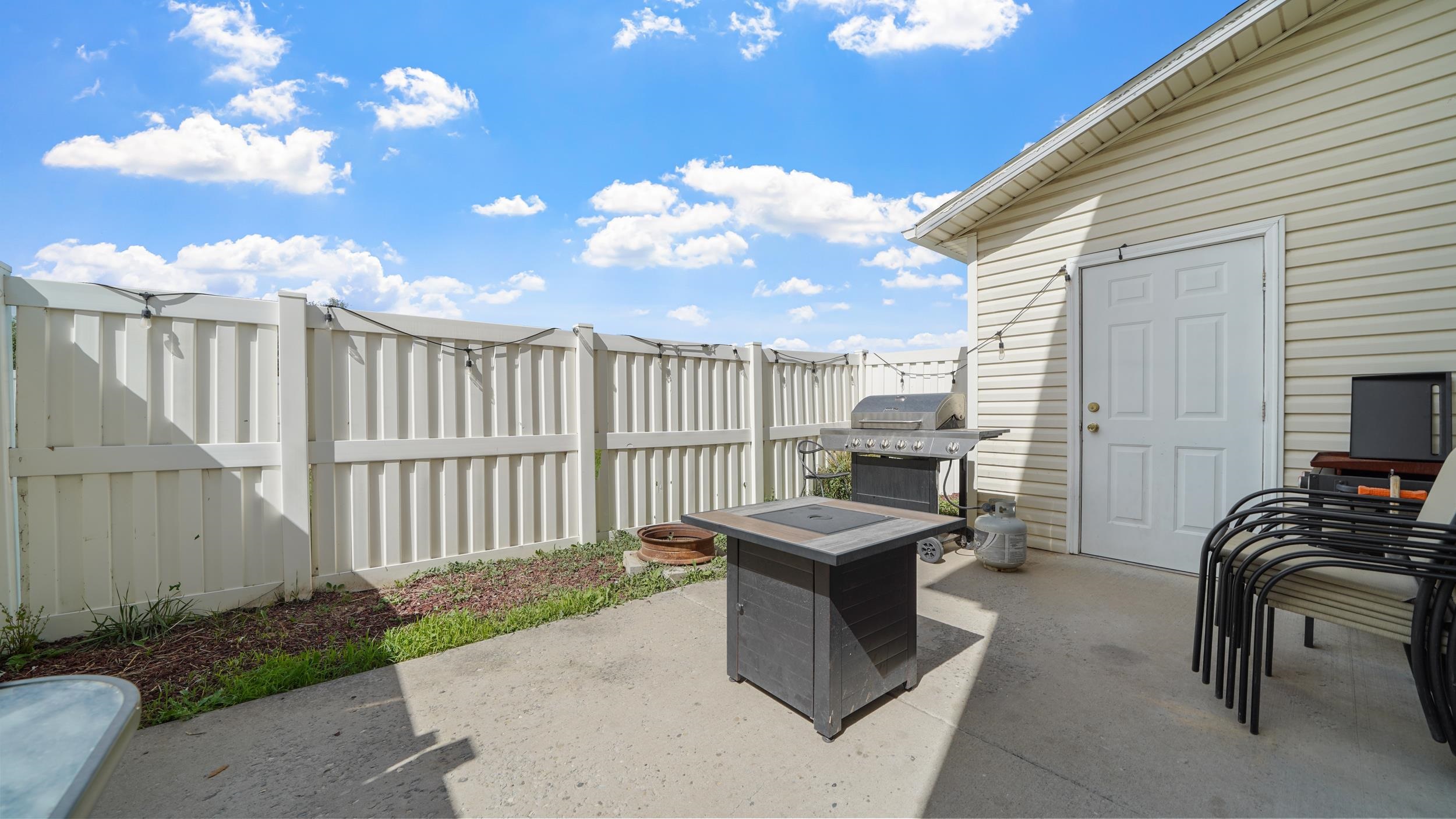 1755 Christopher Way Grand Junction, CO 81503 - Photo 22 of 30 a dinning table and chairs in a patio