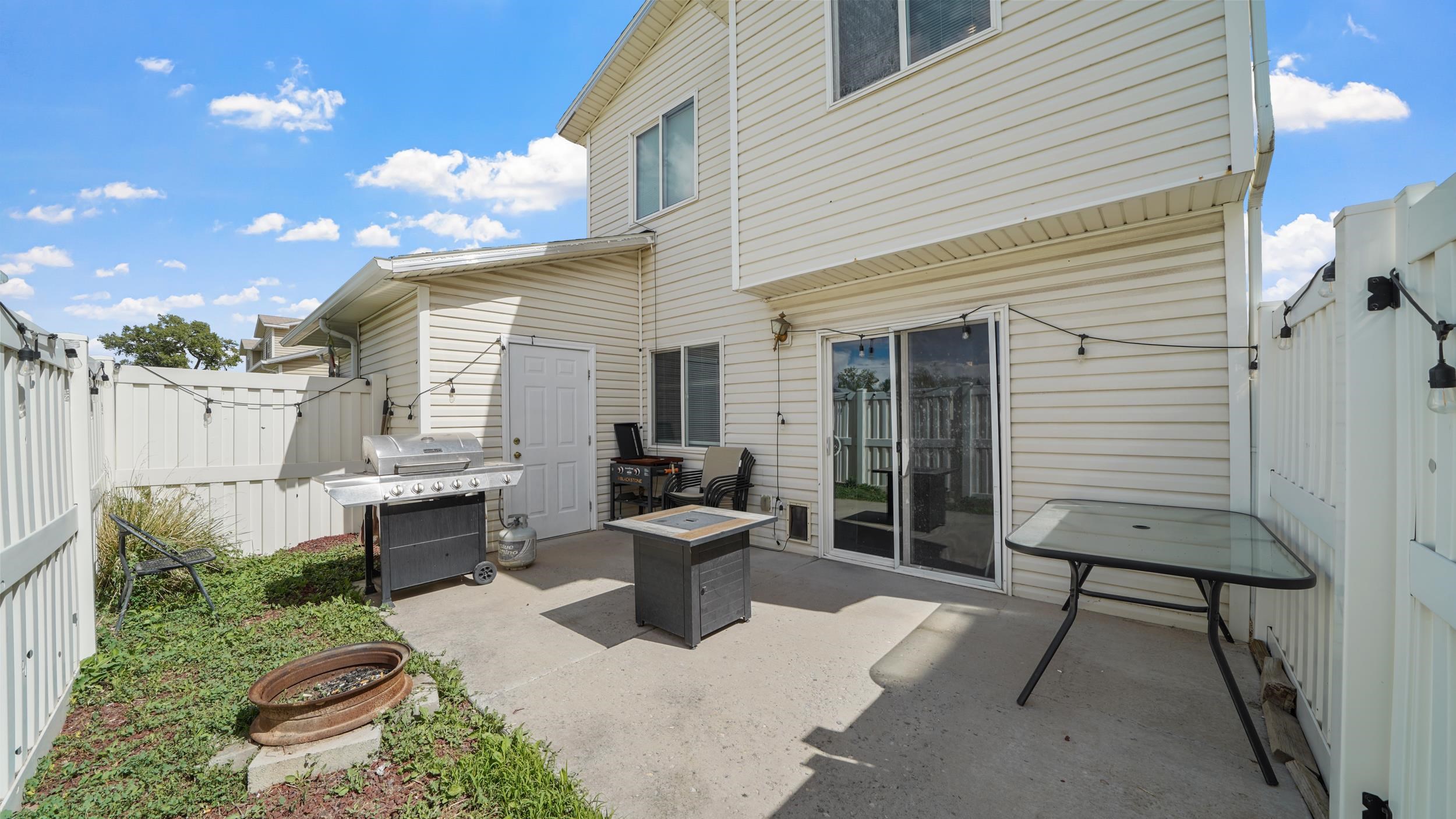 1755 Christopher Way Grand Junction, CO 81503 - Photo 23 of 30 a view of a patio with chairs potted plants and a large tree