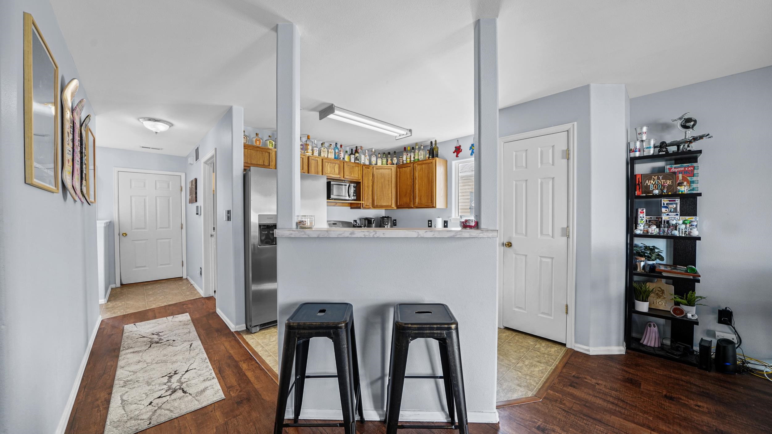 1755 Christopher Way Grand Junction, CO 81503 - Photo 6 of 30 a view of kitchen and dining room with wooden floor