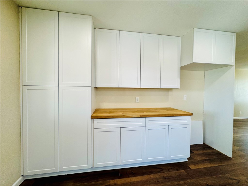 1185 Fm 1540 Sandia, TX 78383 - Photo 11 of 29 a view of kitchen with white cabinets and wooden floor