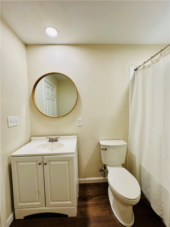 1185 Fm 1540 Sandia, TX 78383 - Photo 13 of 29 a bathroom with a toilet a sink and a mirror