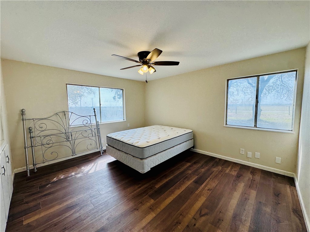 1185 Fm 1540 Sandia, TX 78383 - Photo 19 of 29 a living room with hard wood floors and a ceiling fan