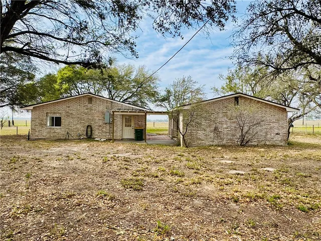 a house view with a backyard space