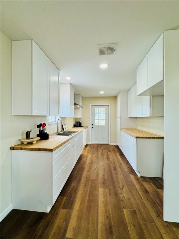 1185 Fm 1540 Sandia, TX 78383 - Photo 8 of 29 a large white kitchen with granite countertop a sink and dishwasher a stove top oven with wooden floor