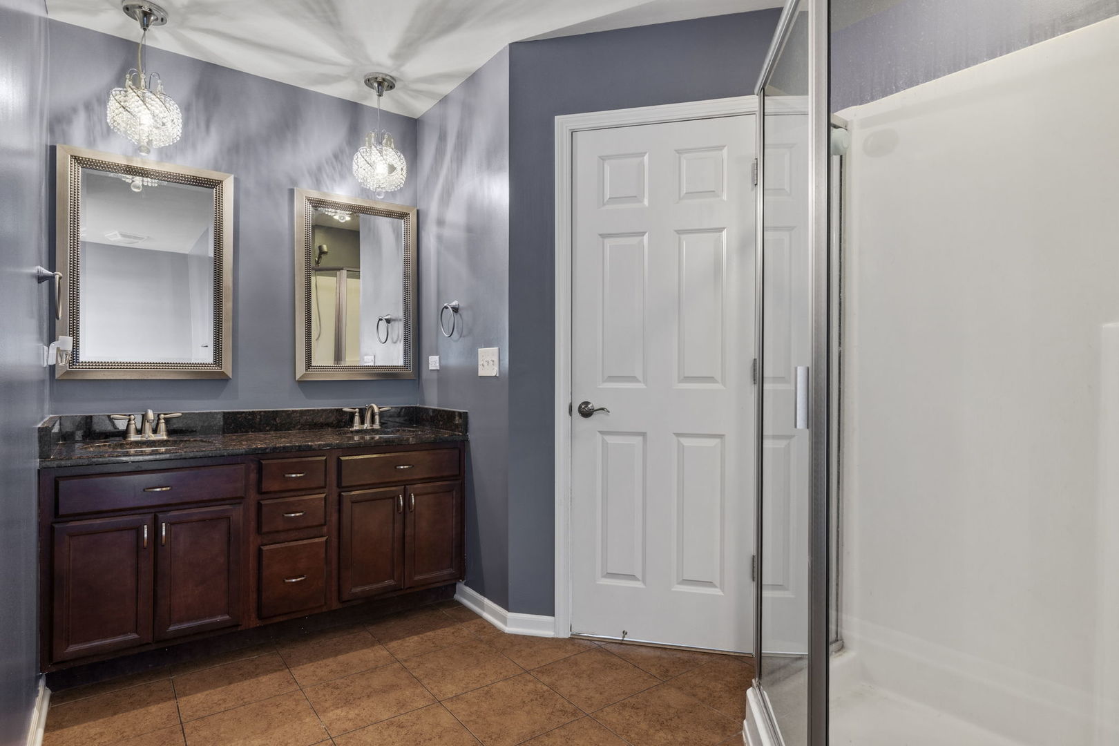 526 Lily Court Minooka, IL 60447 - Photo 18 of 26 a bathroom with a granite countertop sink and a mirror