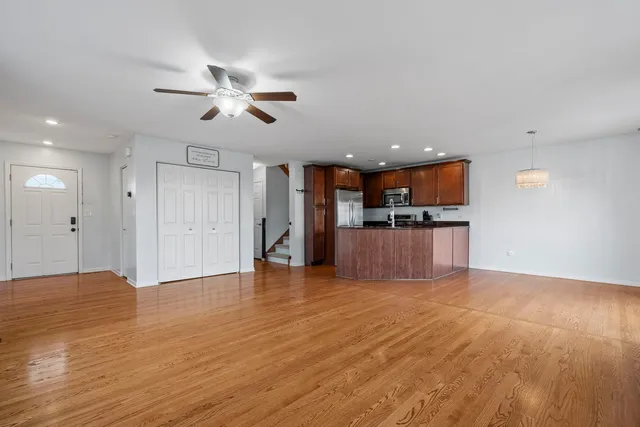 a view of kitchen with cabinets and wooden floor