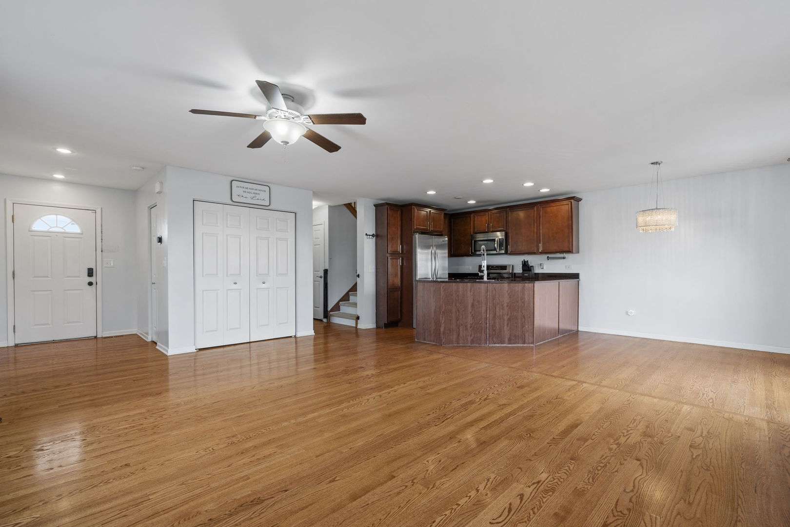 526 Lily Court Minooka, IL 60447 - Photo 2 of 26 a view of kitchen with cabinets and wooden floor