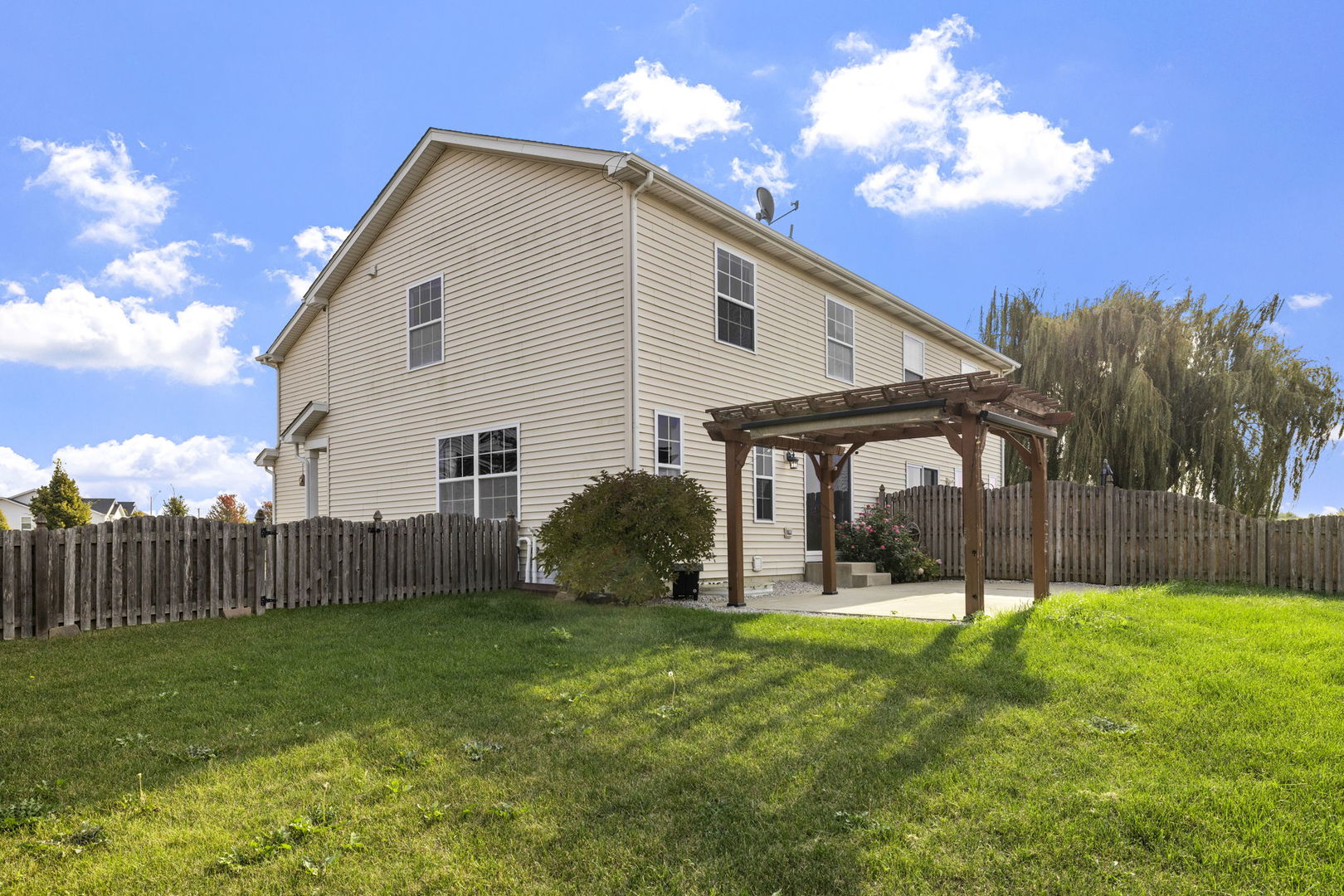 526 Lily Court Minooka, IL 60447 - Photo 26 of 26 a view of a house with a yard