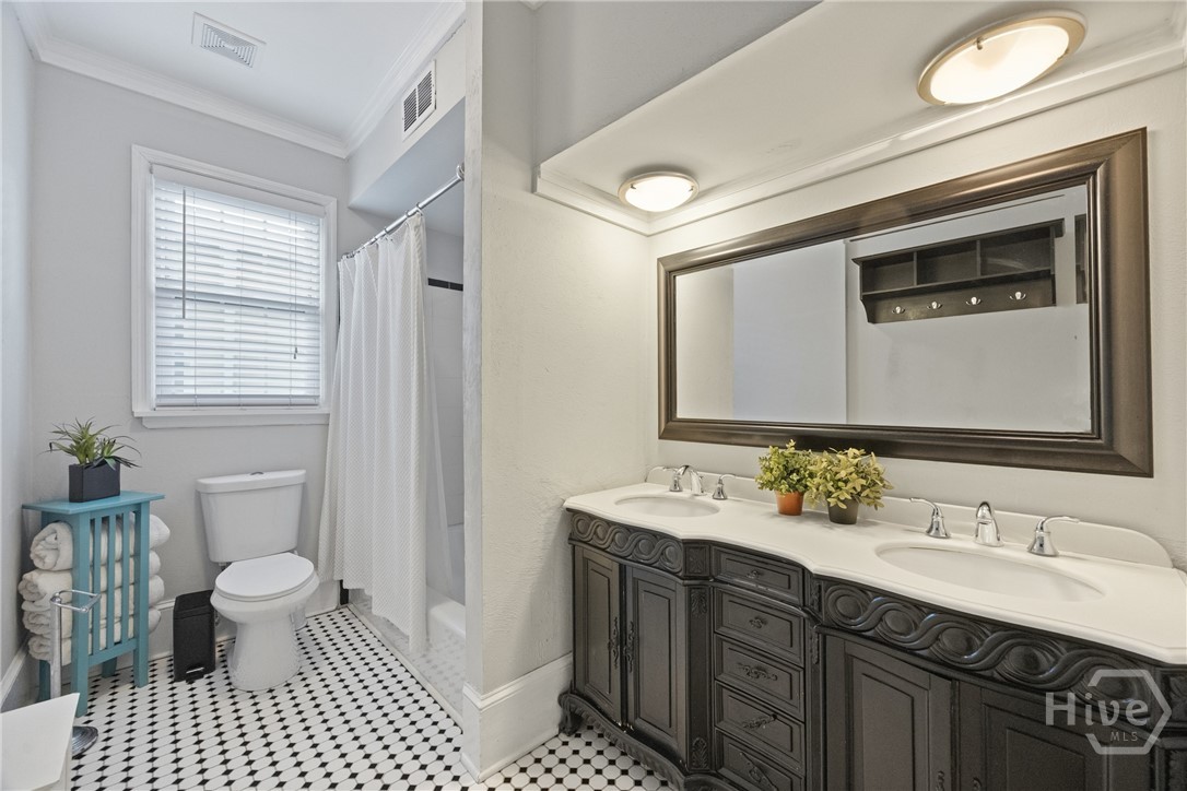 217 Abercorn Street, Unit B3 Savannah, GA 31401 - Photo 19 of 25 Bathroom with double vanity and tub
