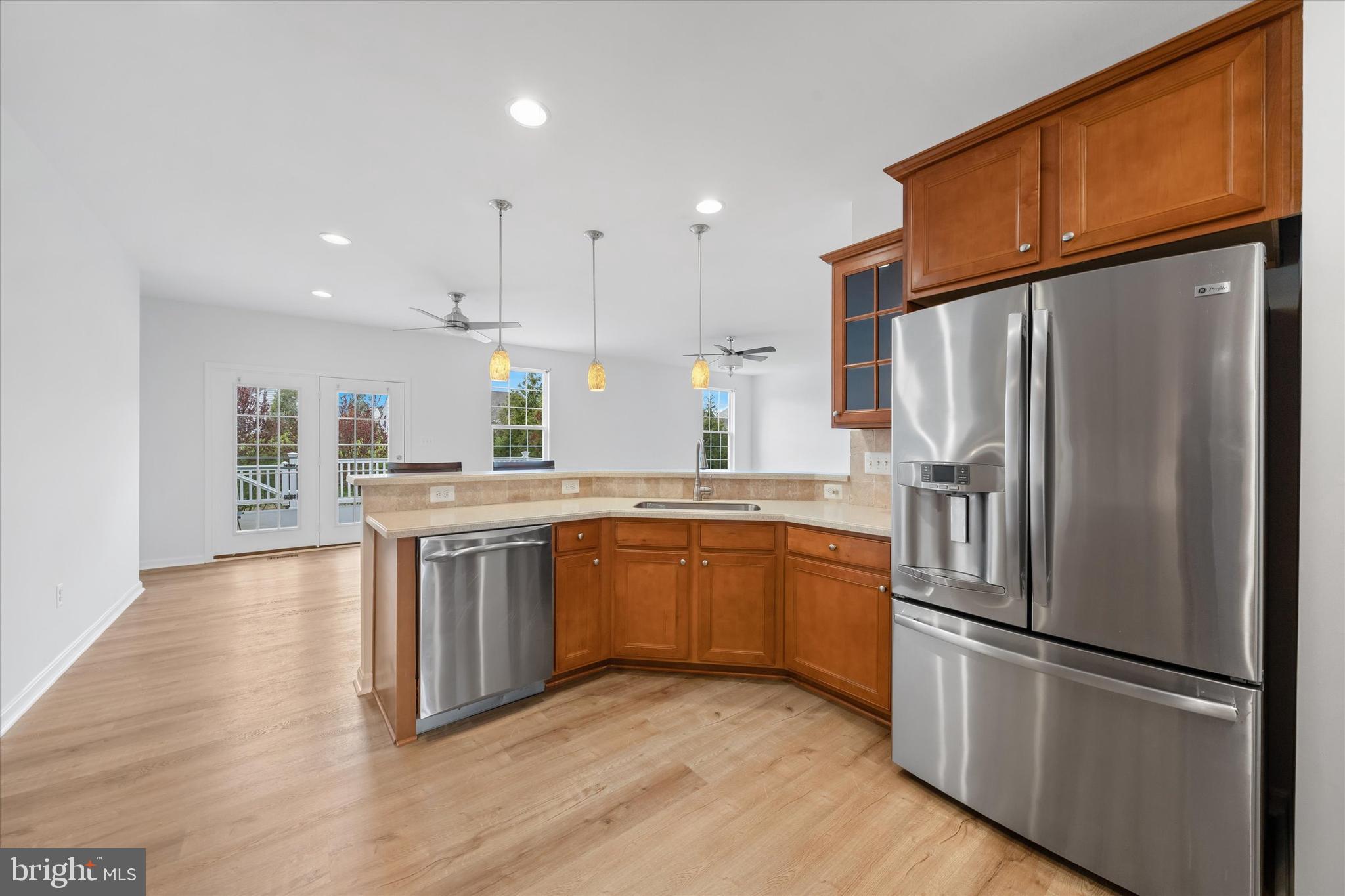 424 Winterberry Drive Middletown, DE 19709 - Photo 12 of 43 a kitchen with stainless steel appliances granite countertop a refrigerator a stove and a sink